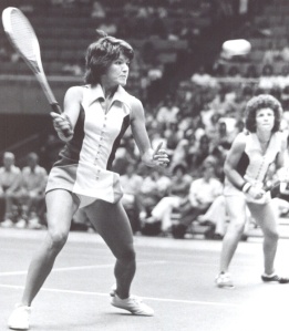 Billy Jean King returning a volley.