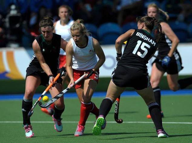 Jo Westwood (left in black) playing hockey for Wales